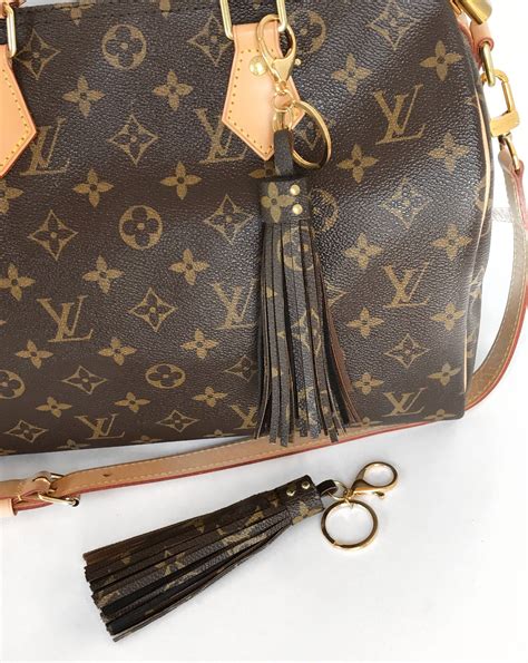 louis vuitton tassel bag|louis vuitton luggage holder.